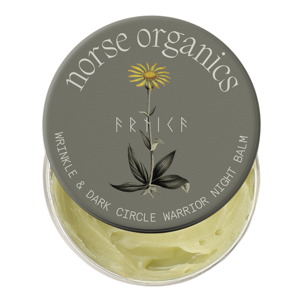 Nachtbalsam gegen Falten & Augenringe Dose mit botanischem Arnika-Deckeldesign und gelbem natürlichem Balsam